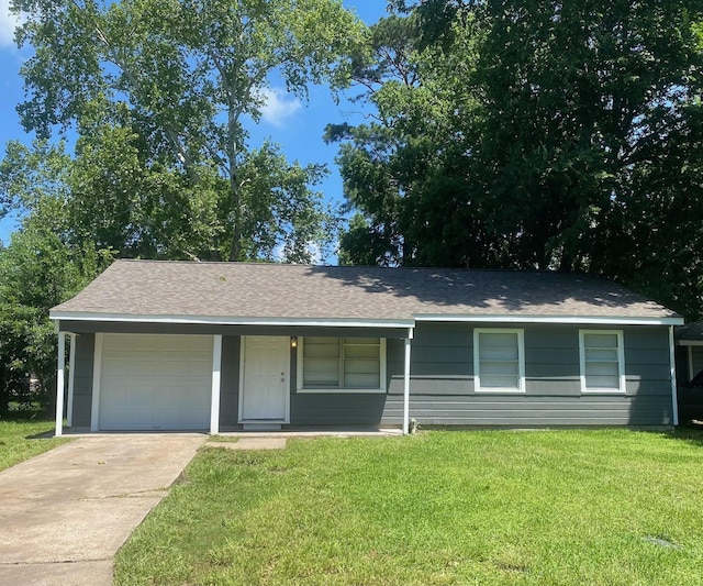 ranch-style house with a front lawn, an attached garage, driveway, and roof with shingles