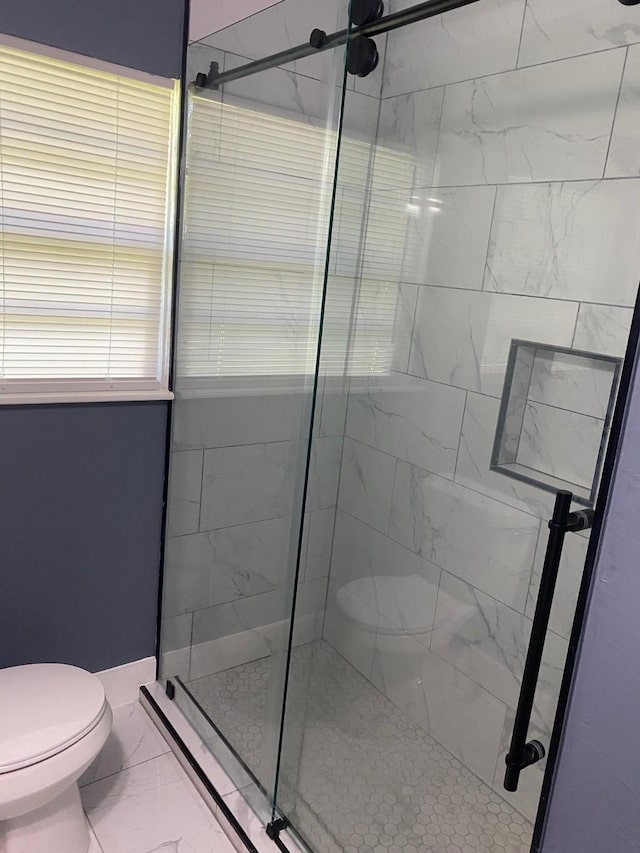 full bathroom with toilet, a shower stall, and marble finish floor