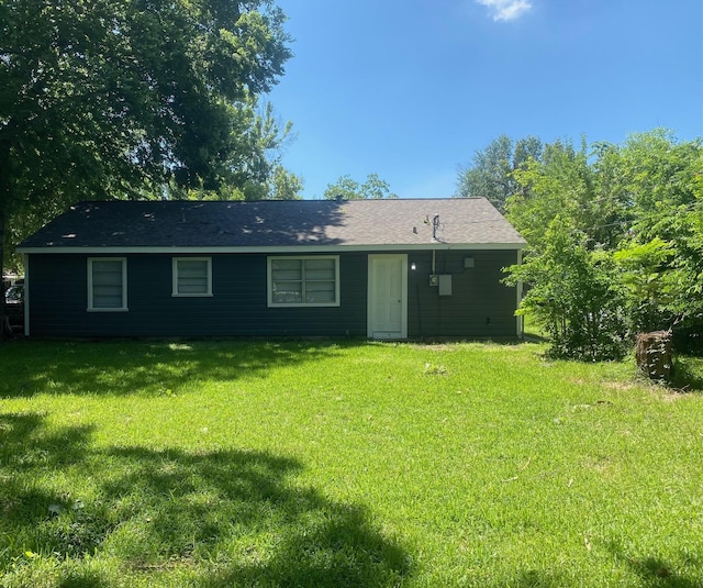 back of property with a yard