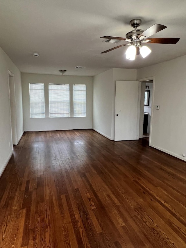 206 W 44th St, Houston, TX 77018 - spare room featuring dark wood-style floors, baseboards, visible vents, and ceiling fan