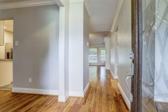 2510 Cobble Ridge Dr, Sugar Land, TX 77498 - corridor featuring light wood-style flooring, ornamental molding, and baseboards