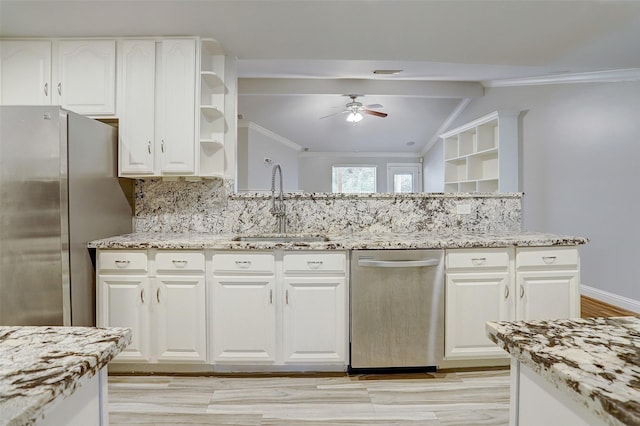 2510 Cobble Ridge Dr, Sugar Land, TX 77498 - kitchen featuring stainless steel appliances, a ceiling fan, a sink, open shelves, and decorative backsplash