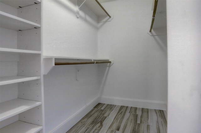 2510 Cobble Ridge Dr, Sugar Land, TX 77498 - walk in closet featuring wood finished floors