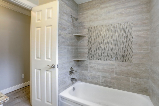 2510 Cobble Ridge Dr, Sugar Land, TX 77498 - full bathroom with washtub / shower combination, baseboards, and wood finished floors