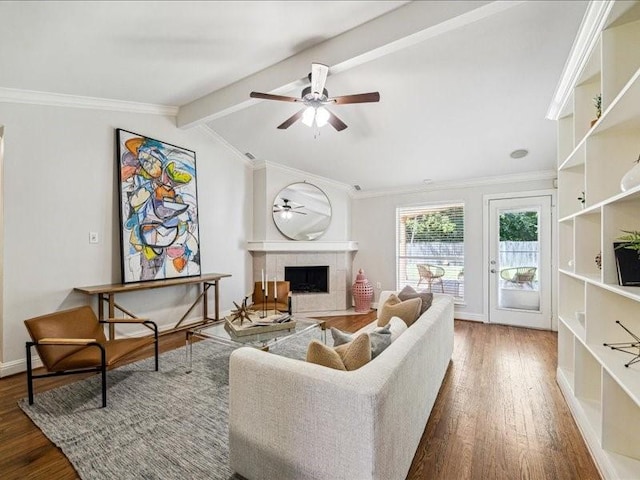 2510 Cobble Ridge Dr, Sugar Land, TX 77498 - living area with a ceiling fan, wood finished floors, a tile fireplace, ornamental molding, and baseboards