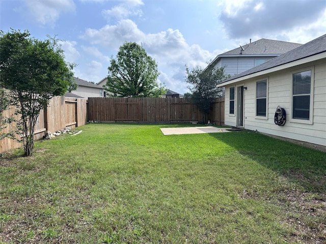 view of yard featuring a fenced backyard and a patio