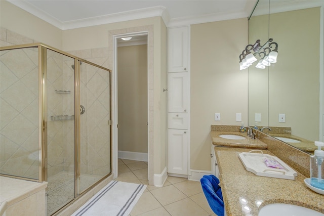full bathroom featuring a sink, tile patterned floors, a shower stall, and double vanity
