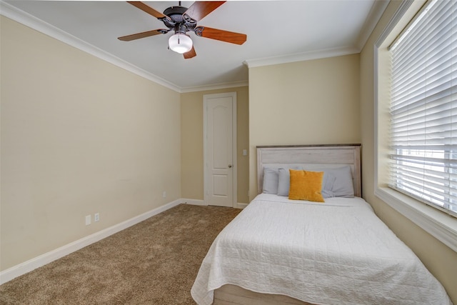 bedroom featuring crown molding, carpet flooring, baseboards, and ceiling fan