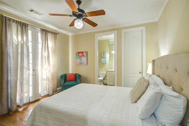 bedroom with ceiling fan, french doors, wood finished floors, ensuite bathroom, and visible vents