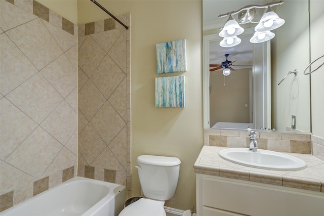 bathroom with vanity, a ceiling fan, shower / bathing tub combination, and toilet
