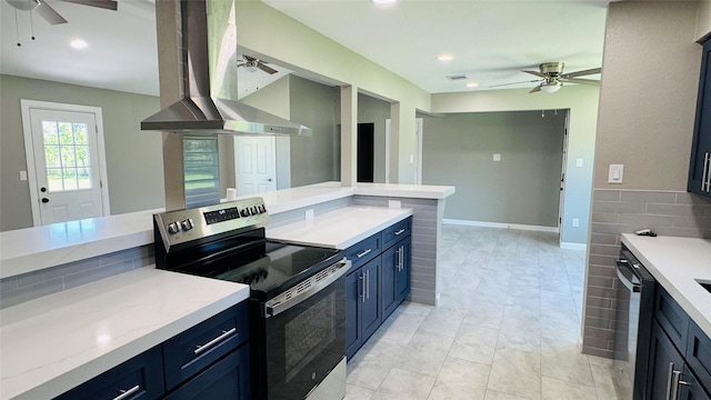 1434 County Road 878a, Sweeny, TX 77480 - kitchen featuring a ceiling fan, stainless steel appliances, wall chimney range hood, blue cabinets, and recessed lighting