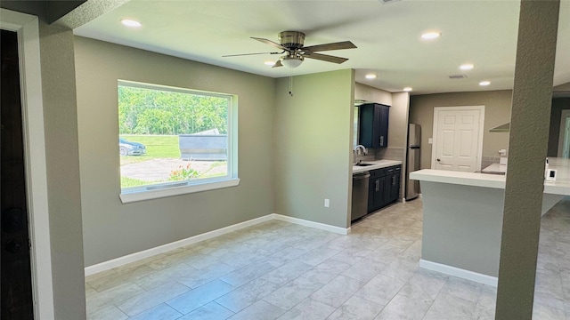 1434 County Road 878a, Sweeny, TX 77480 - kitchen with a sink, light countertops, stainless steel appliances, ceiling fan, and recessed lighting