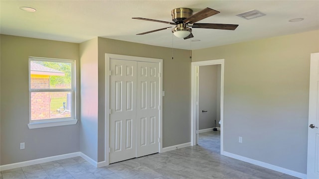 1434 County Road 878a, Sweeny, TX 77480 - unfurnished bedroom with a closet, baseboards, and ceiling fan