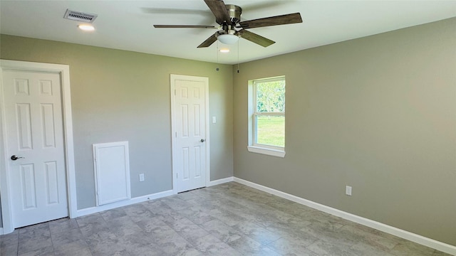 1434 County Road 878a, Sweeny, TX 77480 - unfurnished bedroom featuring baseboards and a ceiling fan
