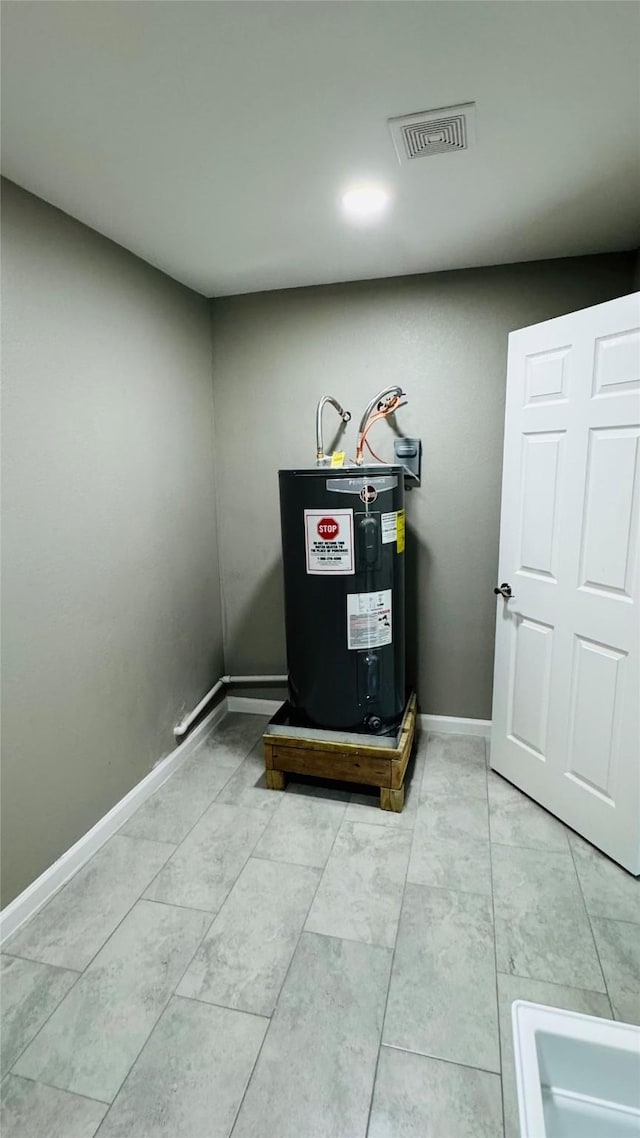 1434 County Road 878a, Sweeny, TX 77480 - detailed view of electric water heater and baseboards
