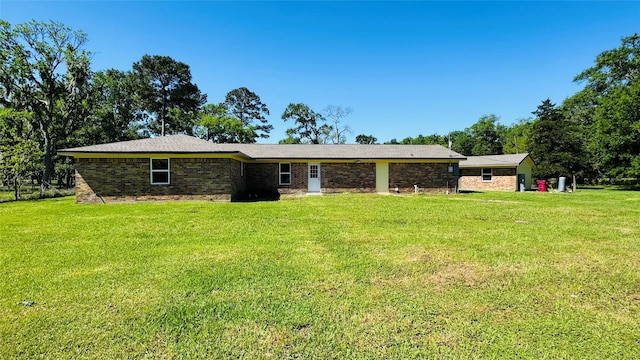 1434 County Road 878a, Sweeny, TX 77480 - rear view of property featuring a lawn and brick siding