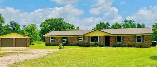 1434 County Road 878a, Sweeny, TX 77480 - ranch-style home featuring a detached garage, an outbuilding, brick siding, central AC, and a front yard