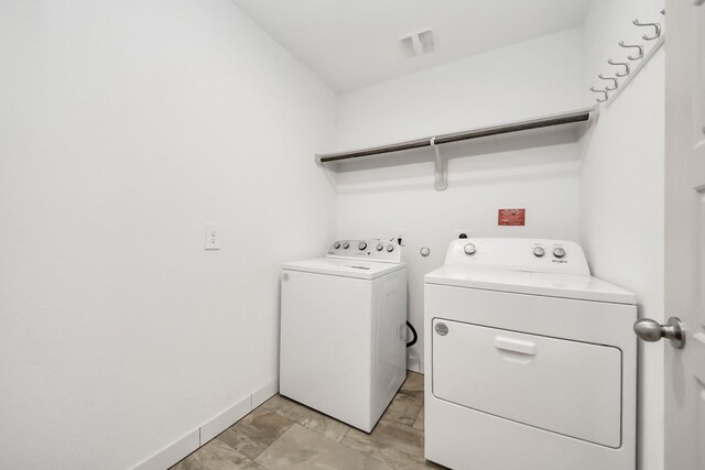 2906 Chase Cross Ln, Houston, TX 77047 - washroom with washer and dryer and baseboards
