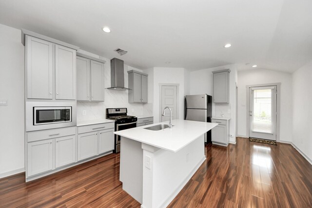 2906 Chase Cross Ln, Houston, TX 77047 - kitchen featuring wall chimney exhaust hood, stainless steel appliances, a sink, gray cabinets, and recessed lighting
