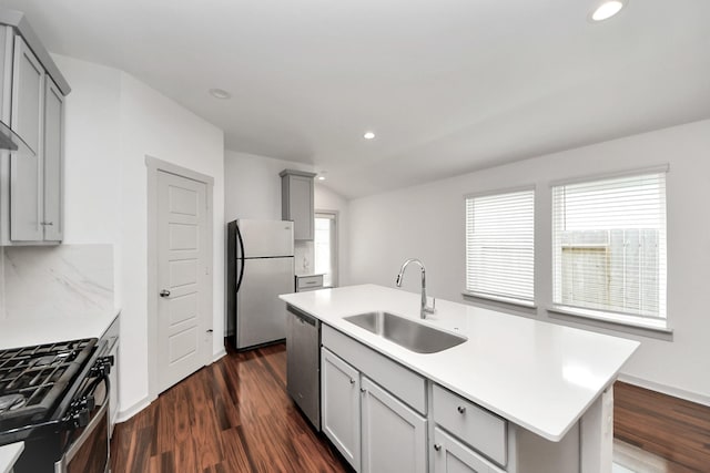 2906 Chase Cross Ln, Houston, TX 77047 - kitchen featuring freestanding refrigerator, a sink, stainless steel dishwasher, gray cabinetry, and range with gas stovetop