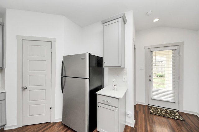 2906 Chase Cross Ln, Houston, TX 77047 - kitchen with freestanding refrigerator, dark wood-style floors, light countertops, recessed lighting, and baseboards