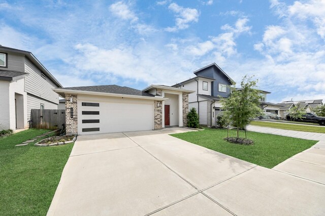 2906 Chase Cross Ln, Houston, TX 77047 - modern home with concrete driveway, stone siding, and an attached garage