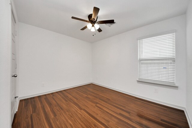 2906 Chase Cross Ln, Houston, TX 77047 - empty room featuring a ceiling fan, wood finished floors, and baseboards