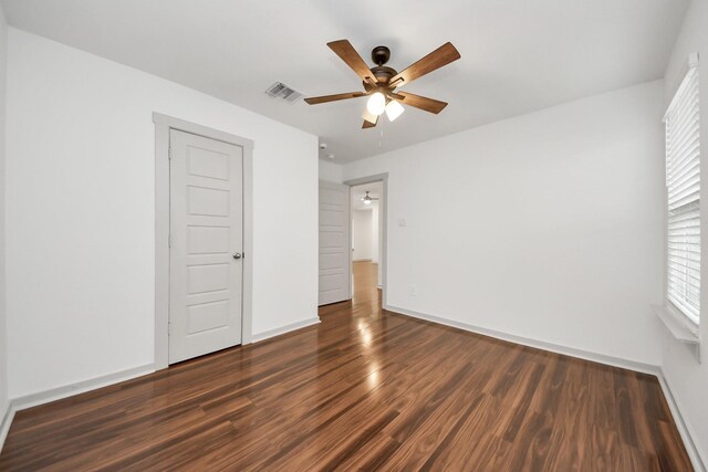 2906 Chase Cross Ln, Houston, TX 77047 - unfurnished bedroom featuring wood finished floors, baseboards, and ceiling fan