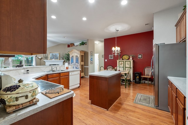 225 Mesa Vw, Montgomery, TX 77316 - kitchen with white dishwasher, freestanding refrigerator, a sink, light wood finished floors, and light countertops