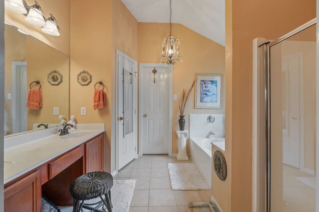 225 Mesa Vw, Montgomery, TX 77316 - bathroom with tile patterned floors, a garden tub, a chandelier, double vanity, and high vaulted ceiling