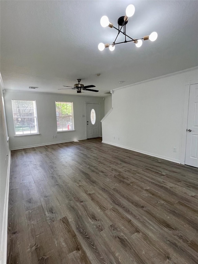 unfurnished living room with visible vents, baseboards, and dark wood-style floors