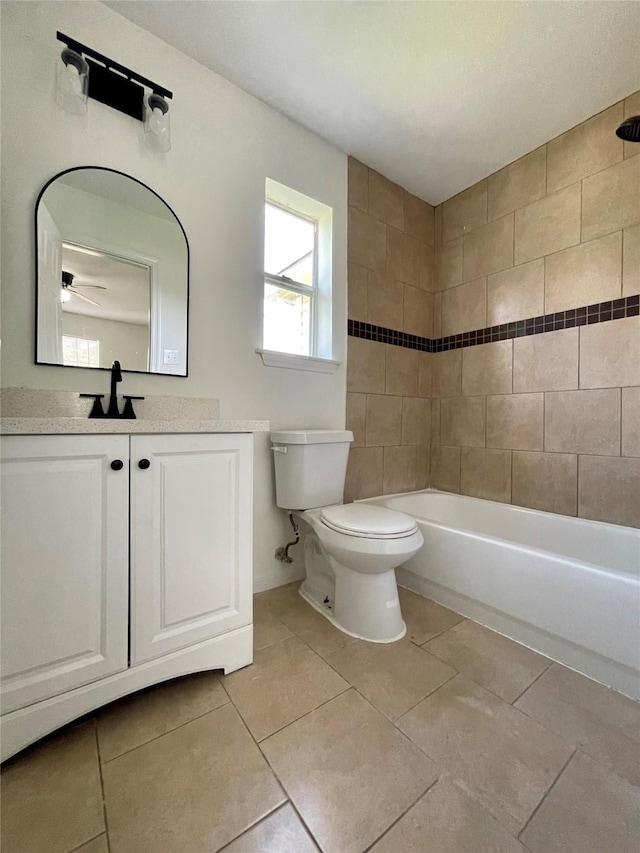 bathroom with tile patterned floors, toilet, ceiling fan, and vanity