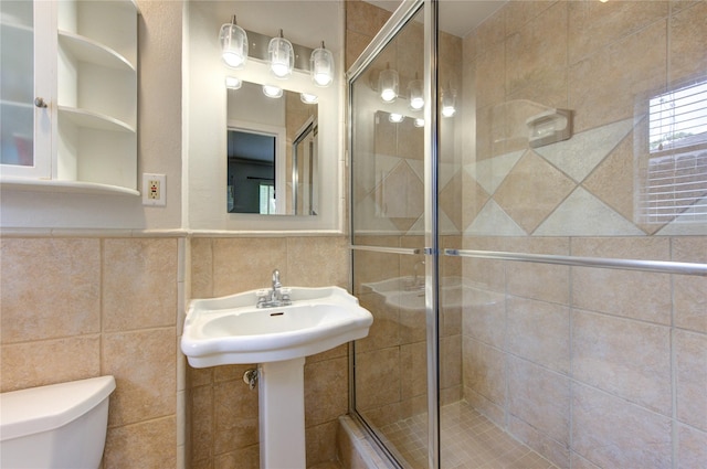 9534 Meadowglen Ln, Houston, TX 77063 - full bath with toilet, a stall shower, and tile walls