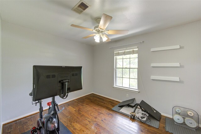9534 Meadowglen Ln, Houston, TX 77063 - exercise area with wood finished floors, ceiling fan, baseboards, and visible vents