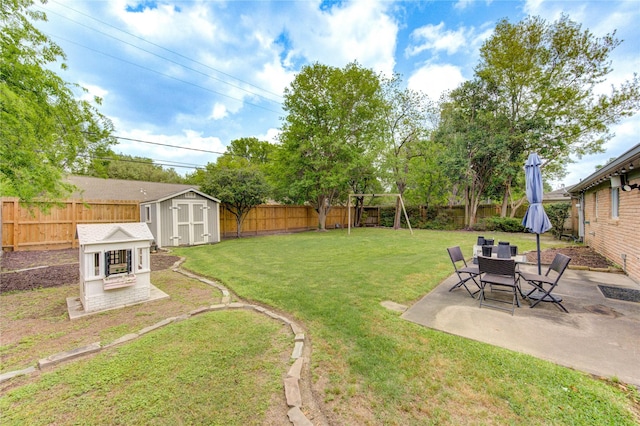 9534 Meadowglen Ln, Houston, TX 77063 - view of yard featuring a shed, a fenced backyard, an outdoor structure, a patio area, and a playground