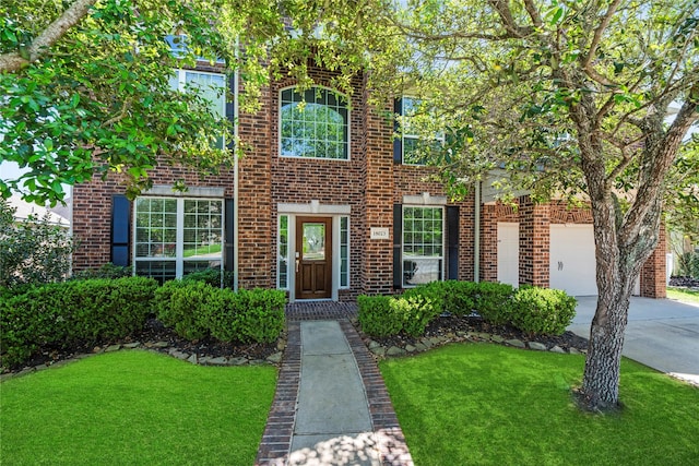 18023 Channel Hill Dr, Cypress, TX 77433 - view of front of property featuring concrete driveway, brick siding, and a front yard