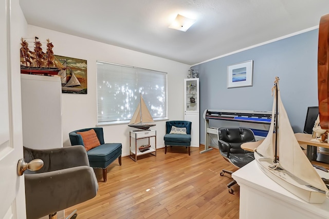 home office with light wood-style floors