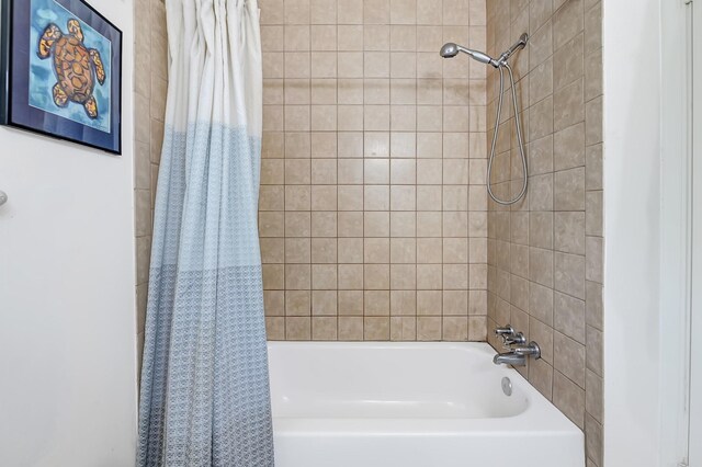 bathroom featuring shower / tub combo with curtain