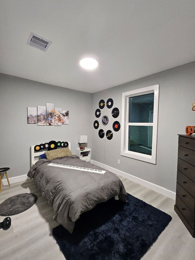 3241 Reeves St, Houston, TX 77004 - bedroom featuring wood finished floors and baseboards