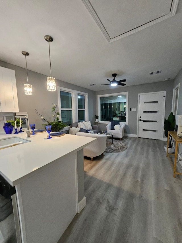 3241 Reeves St, Houston, TX 77004 - living area featuring wood finished floors, ceiling fan, and baseboards