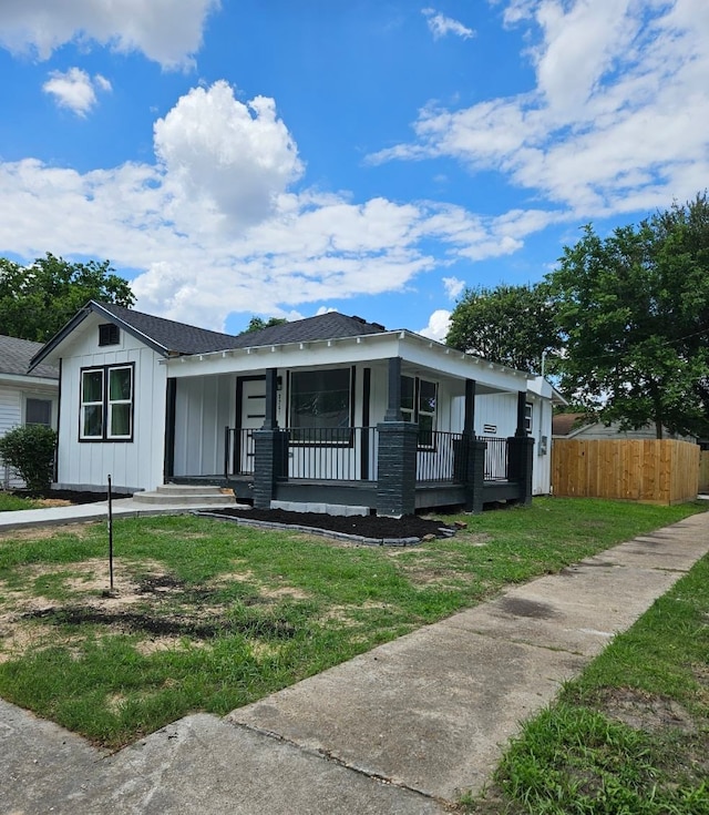 3241 Reeves St, Houston, TX 77004 - view of front facade with covered porch, board and batten siding, and roof with shingles