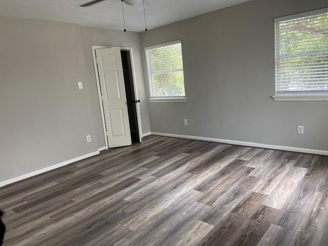 7307 Adelbert St, Houston, TX 77093 - empty room with healthy amount of natural light, dark wood-style flooring, and ceiling fan