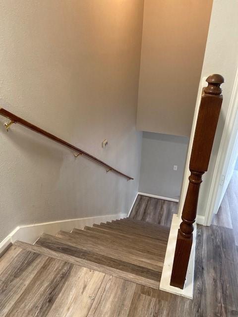 7307 Adelbert St, Houston, TX 77093 - staircase with wood finished floors and baseboards