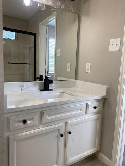 7307 Adelbert St, Houston, TX 77093 - full bath featuring vanity, healthy amount of natural light, a stall shower, and tile patterned floors