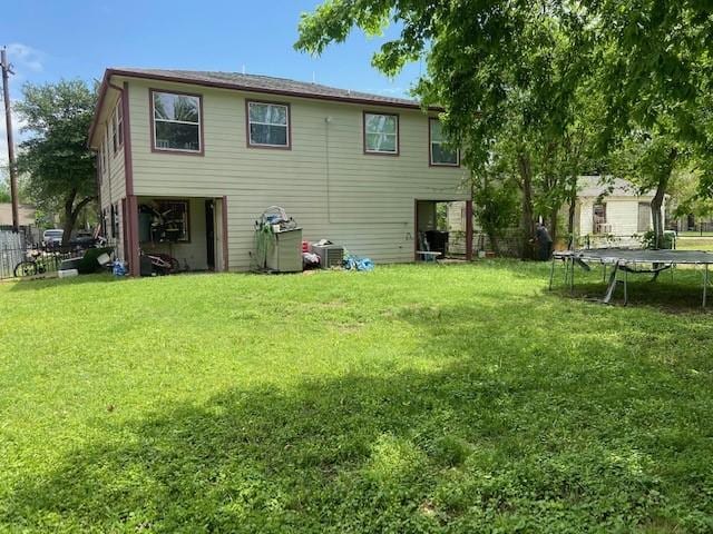 7307 Adelbert St, Houston, TX 77093 - rear view of property with a trampoline