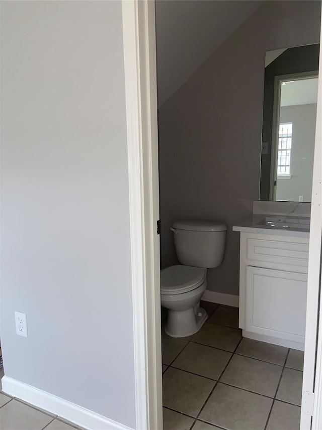 7307 Adelbert St, Houston, TX 77093 - bathroom featuring vanity, tile patterned flooring, and lofted ceiling