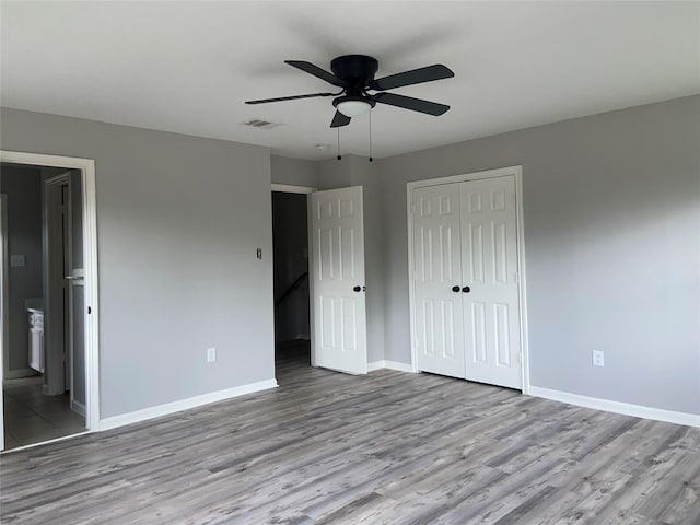 7307 Adelbert St, Houston, TX 77093 - unfurnished bedroom featuring wood finished floors, a closet, ceiling fan, and ensuite bath