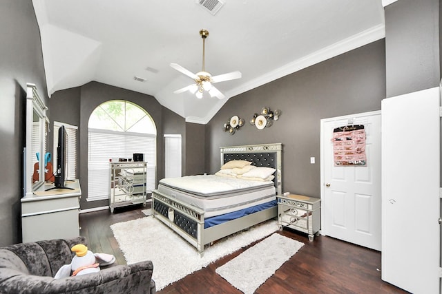 bedroom featuring wood finished floors, vaulted ceiling, ceiling fan, and ornamental molding