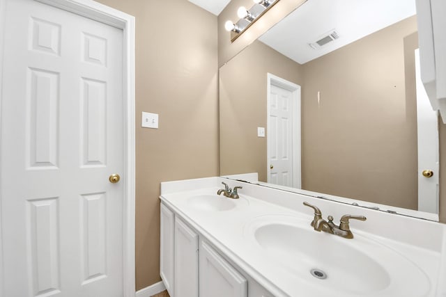 bathroom featuring double vanity