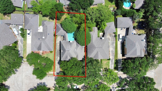 aerial perspective of suburban area featuring a pool area